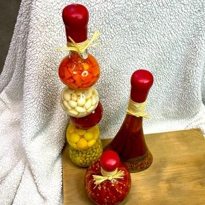 Three decorative bottles w/pickled vegetables